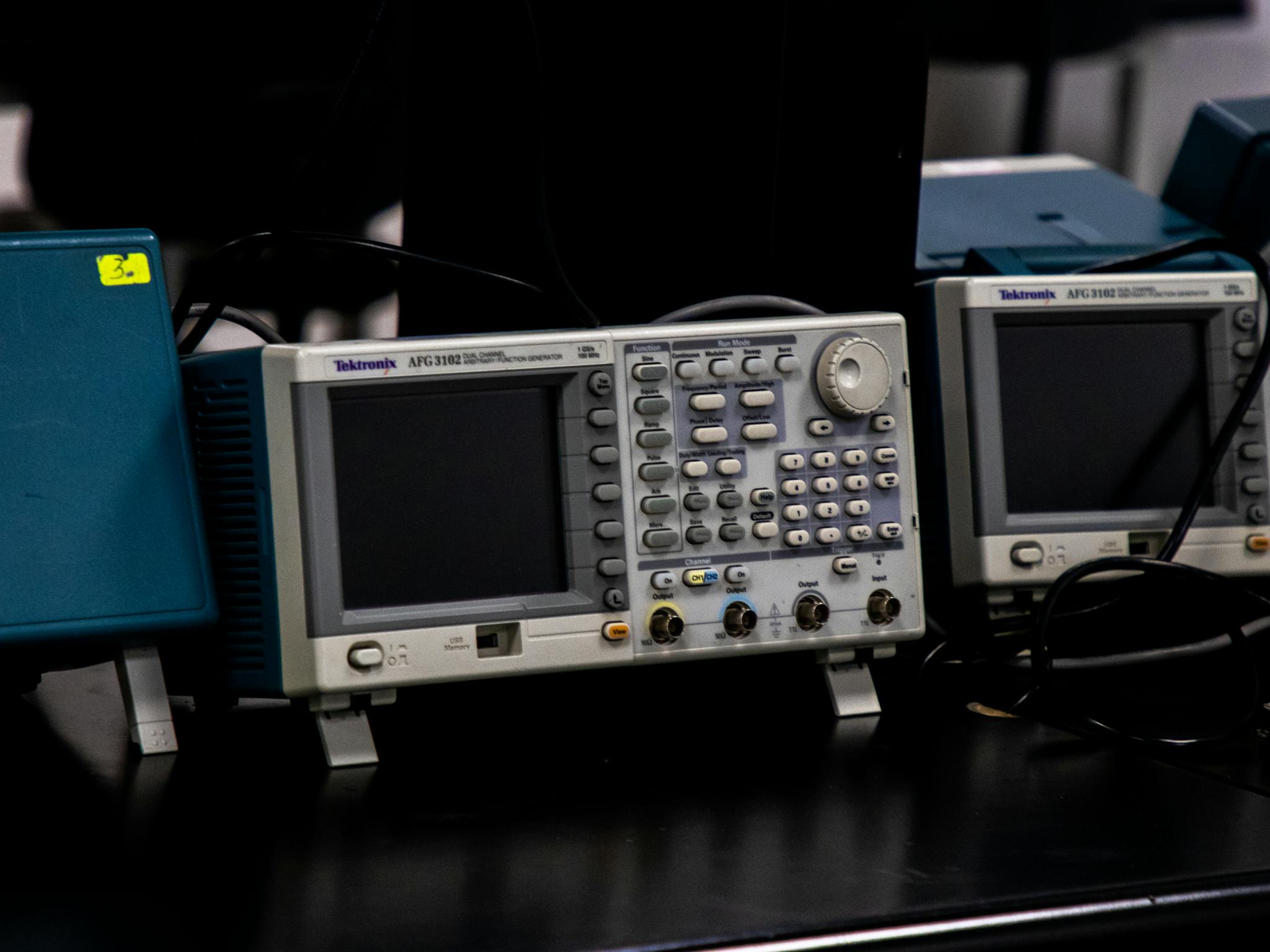 Close-up of electronic measuring equipment in a lab setting, showcasing precision technology.